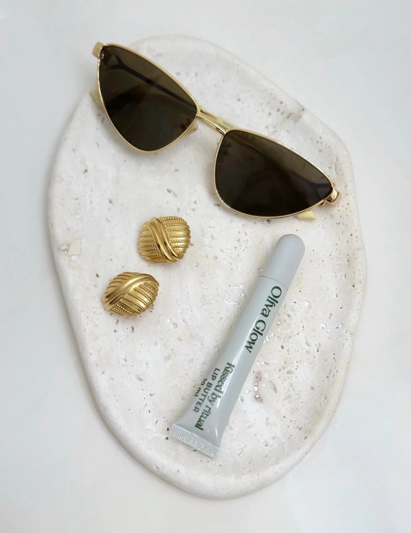 Olíva Glow Lip Butter providing deep hydration, cooling peppermint finish, and glossy nourishment.