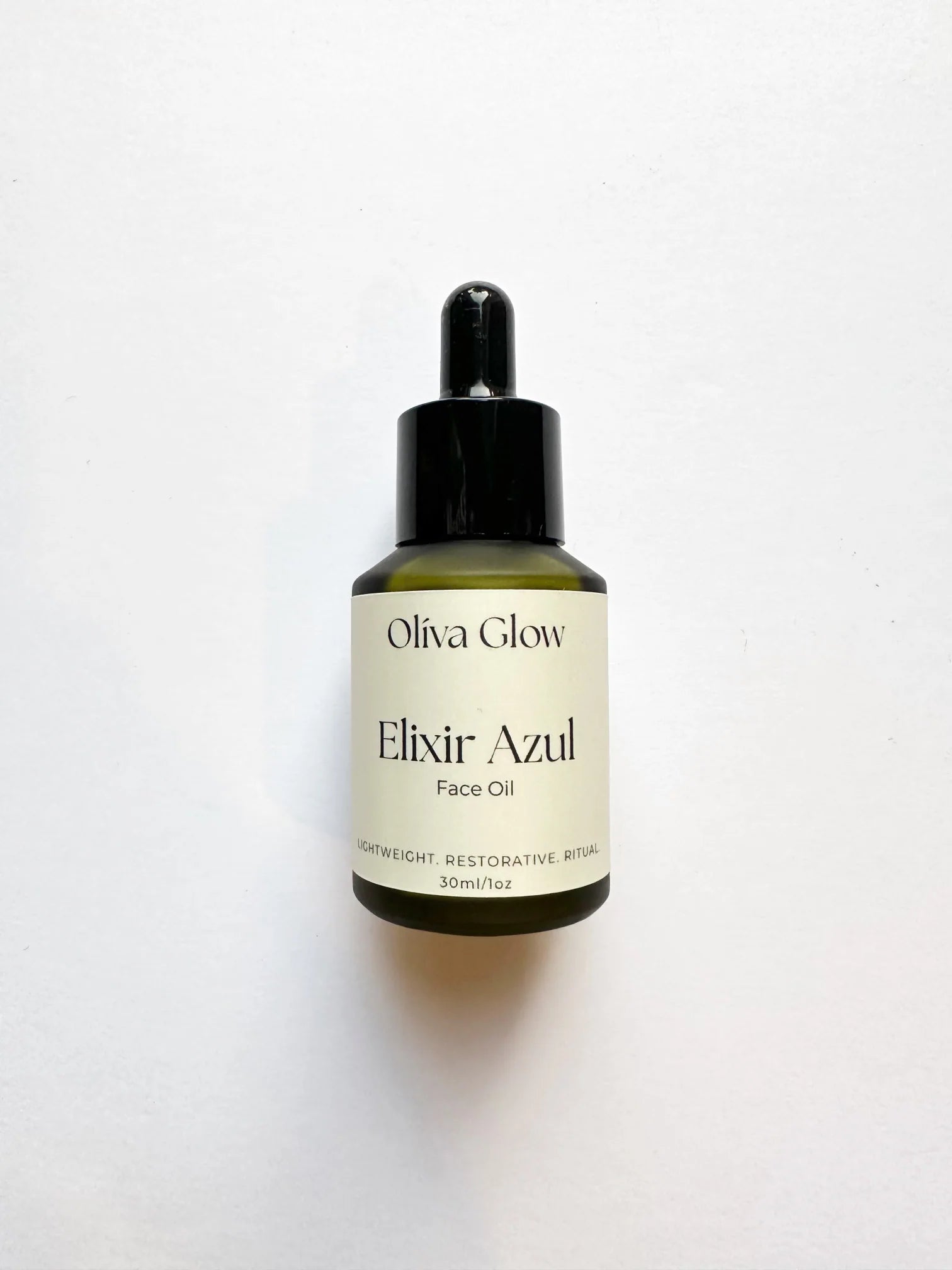 Olíva Glow Elixir Azul face oil with blue tansy and olive extract for calm, radiant, hydrated skin.