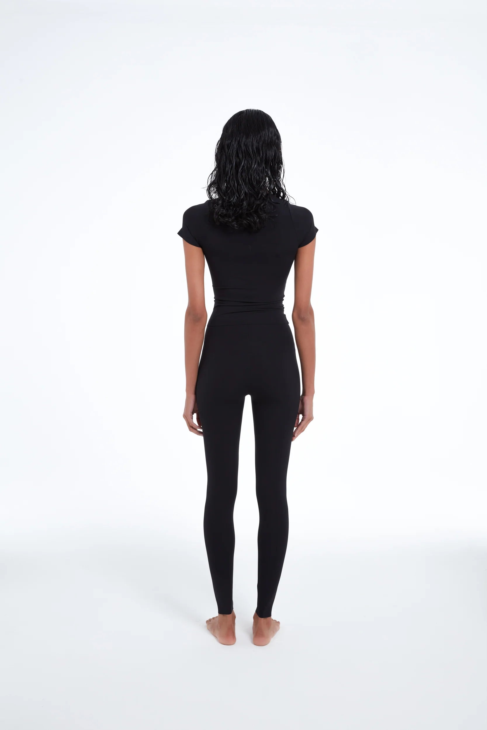TSM Skin Tight Legging in Onyx Black – women’s fitted activewear with laser cut ankle details