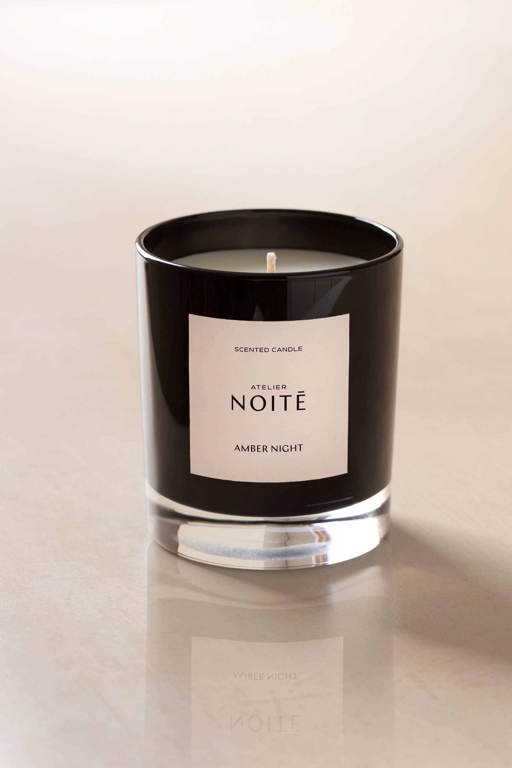 Atelier Noitē Amber Night Candle — warm amber, orange peel & cedarwood vegan candle