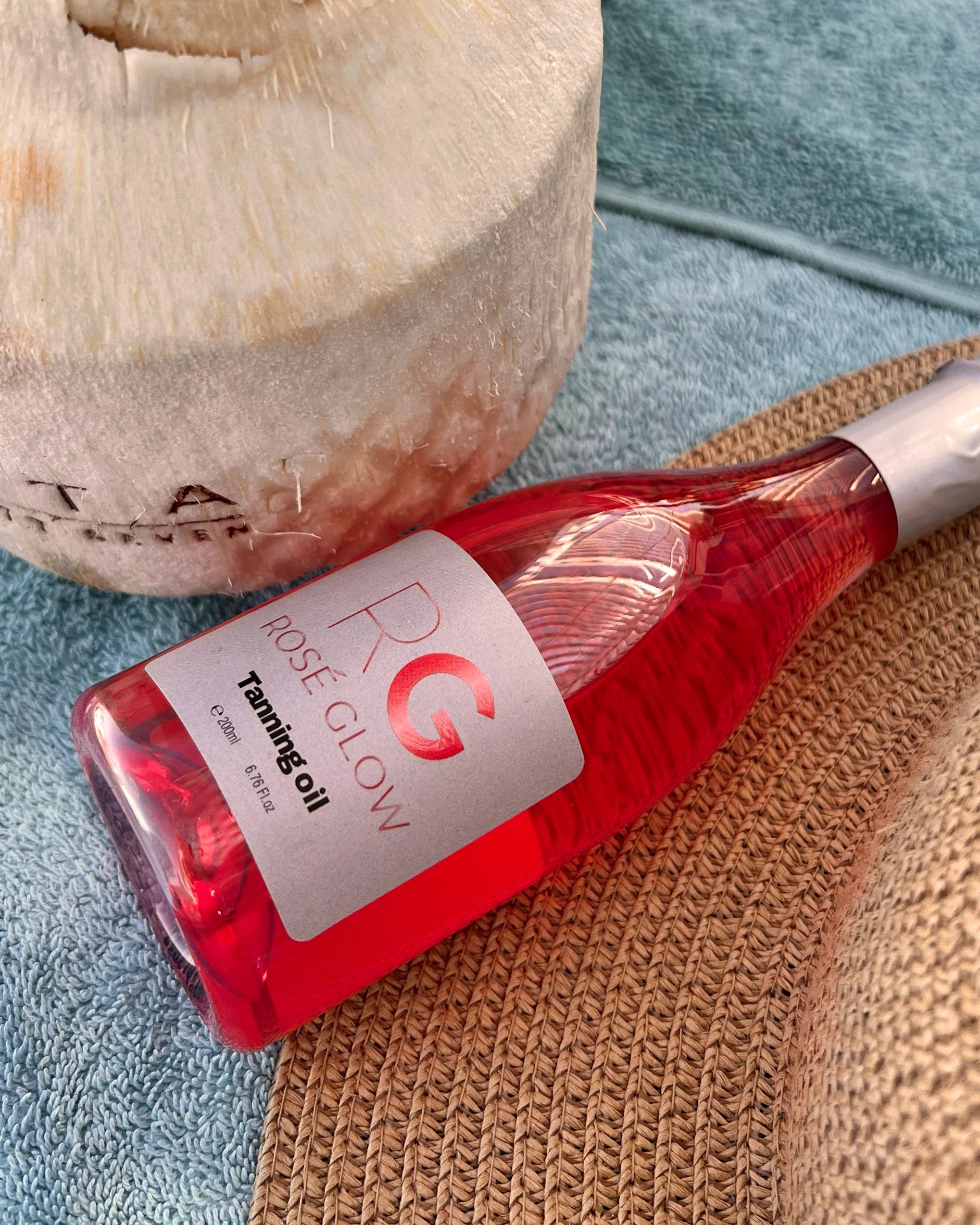 Rosé Glow tanning oil bottle—Vitamin E & grapeseed blend for long‑lasting, luminous skin