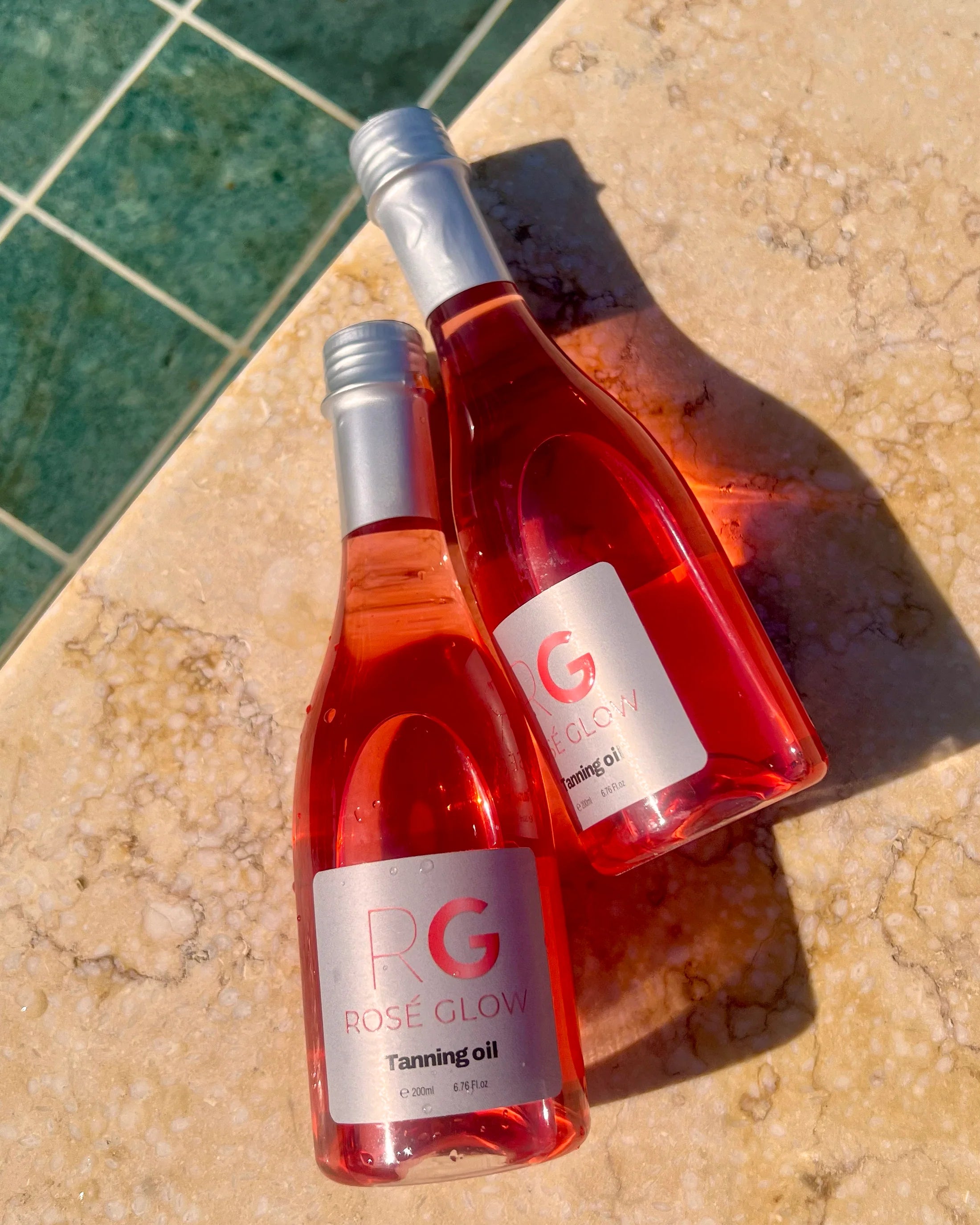 Rosé Glow tanning oil bottle—Vitamin E & grapeseed blend for long‑lasting, luminous skin