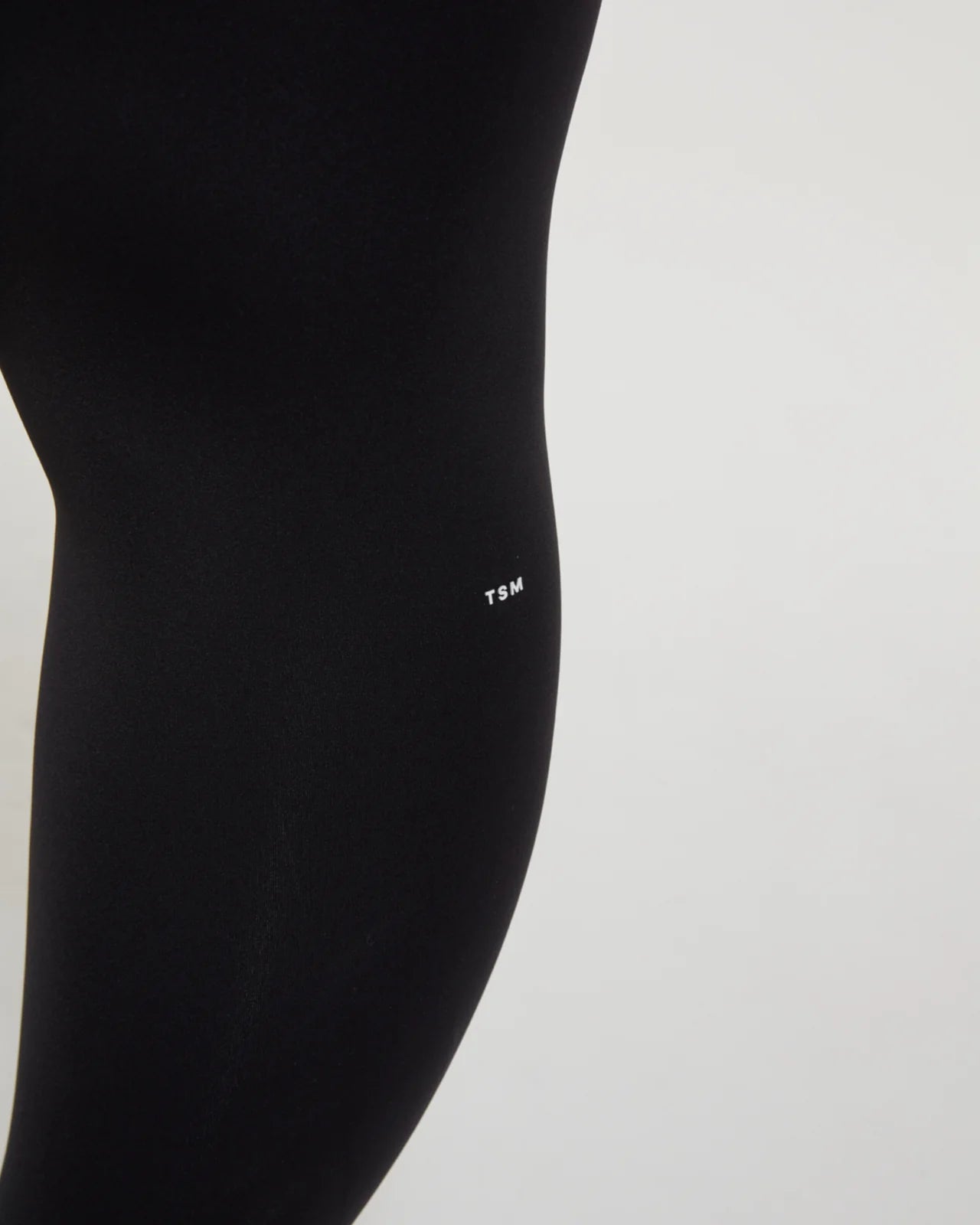 TSM Skin Tight Legging in Onyx Black – women’s fitted activewear with laser cut ankle details